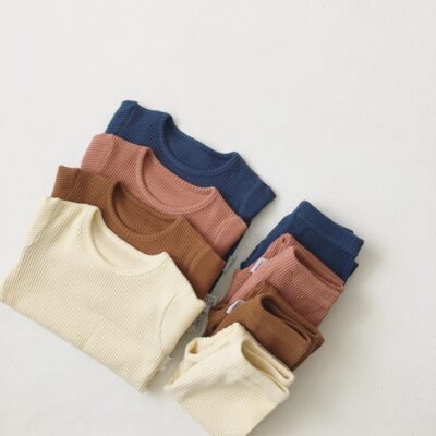 Soft ribbed baby and toddler pajamas in solid color
